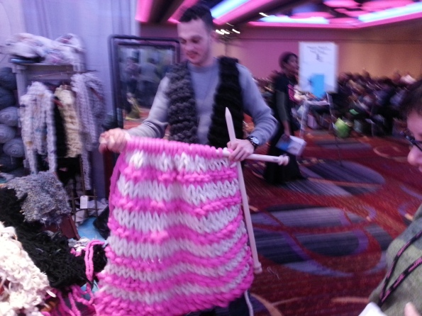 Sorry for the blur, couldn't stop giggling. Note his vest, also made from enormous yarn